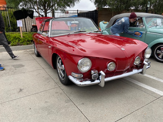 VW cruise night — split-window bus, vintage lineup on main street