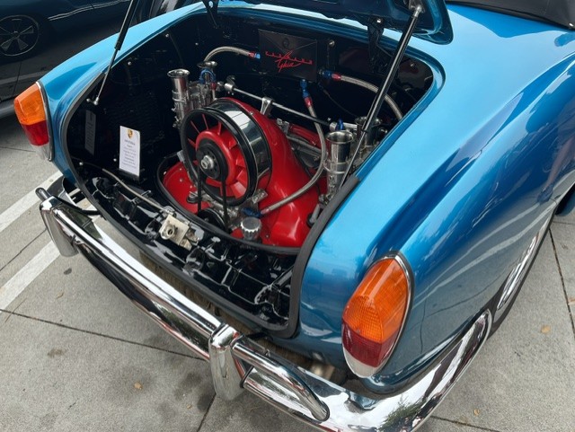Cadillac V16 headers — chrome pipes and leather strap detail