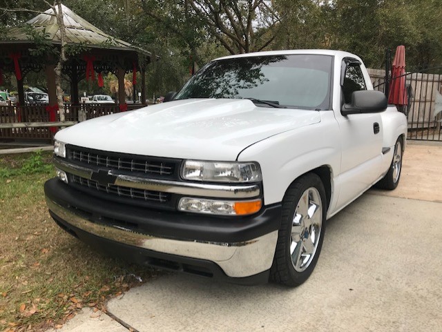 Before — clean white stepside, slammed stance, ready for transformation