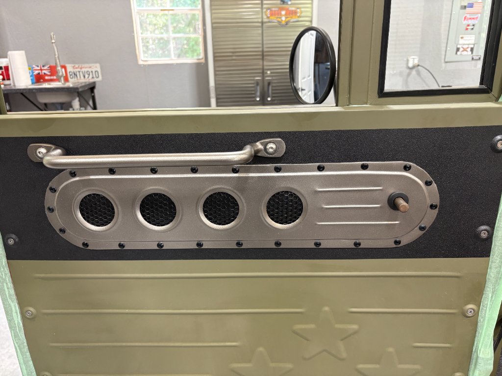 Full door view — completed panel installed with army star emboss and window crank