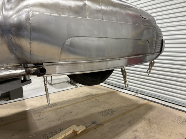 Lower rear section — custom trim piece following the rocker line