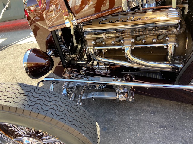 Interior — walnut steering wheel, chrome pedals, tan upholstery