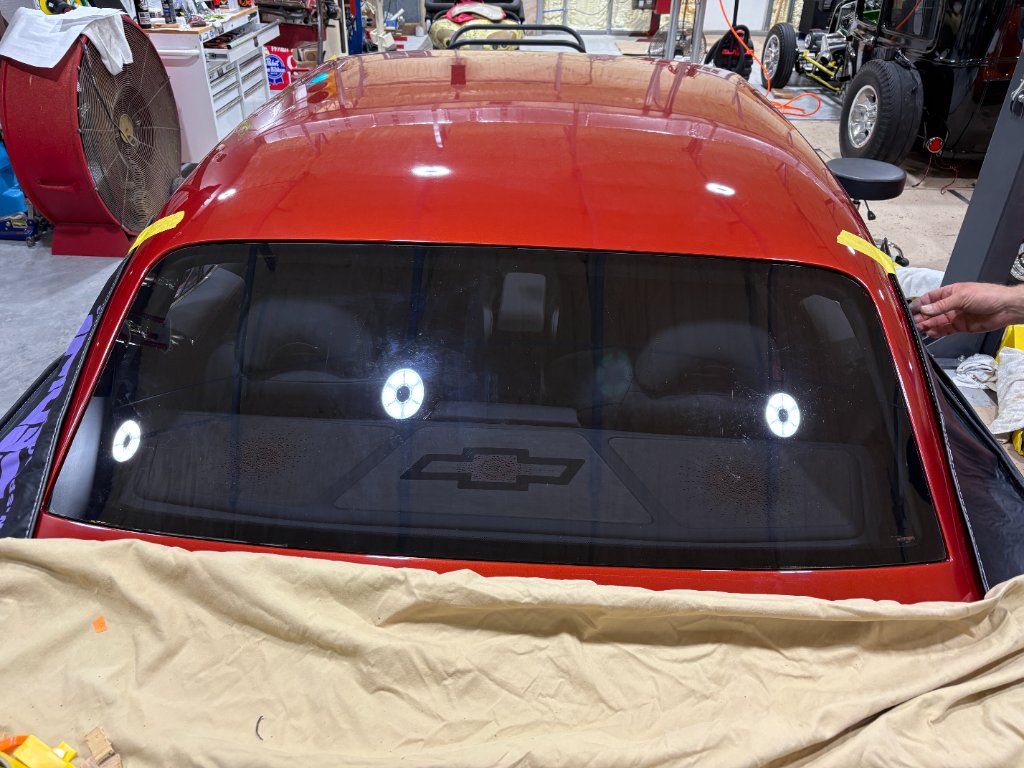 Completed rear glass — perfectly floated, uniform gap, zero visible adhesive