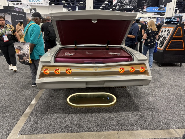 Custom lowrider rear — maroon interior, LED taillights, show display