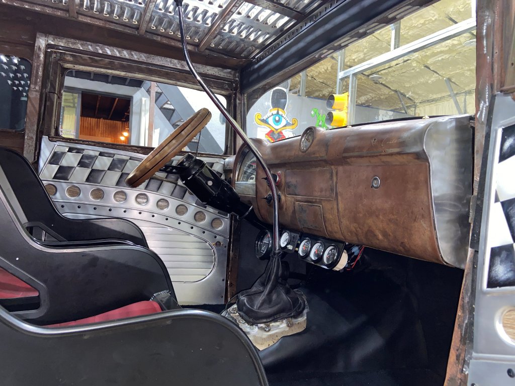 Closed-end dash with custom gauges and copper-patina finish