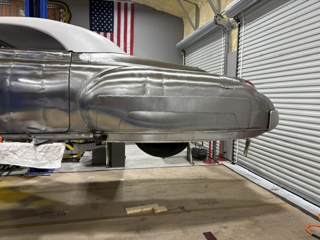 Passenger side — lower quarter extension flowing with the body contour