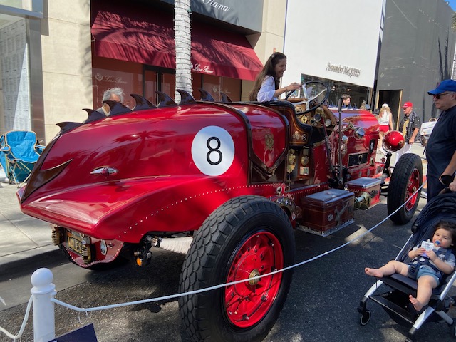 Cadillac engine — polished V16, chromed exhaust, leather hood straps