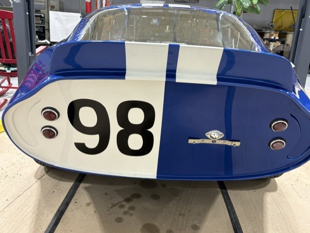 Rear view — iconic Kamm tail, race number 98, dual taillights