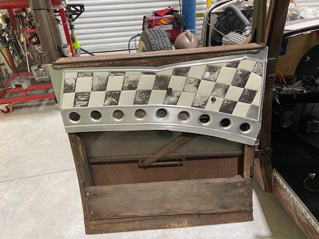 Door panel fitted in door frame — checker top, bead-rolled lower