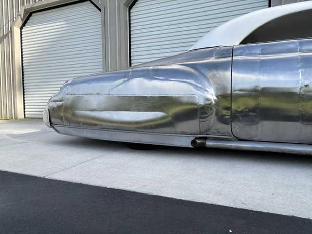 Lower body detail — custom quarter extension seamlessly integrated