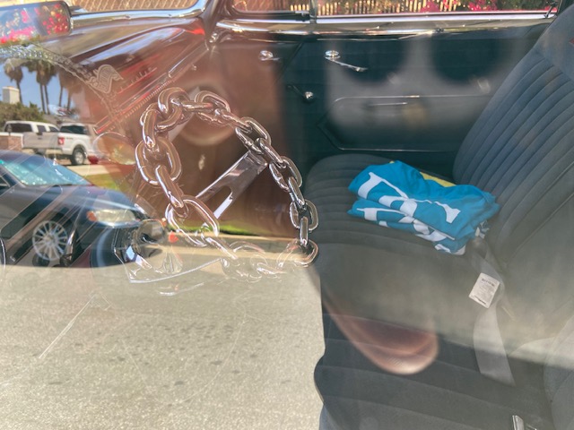 Wayne at the Pomona swap — straw hat, vintage parts in hand