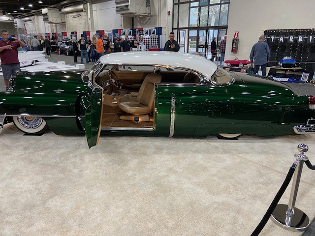 Green 1953 Cadillac custom — white top, GNRS show floor