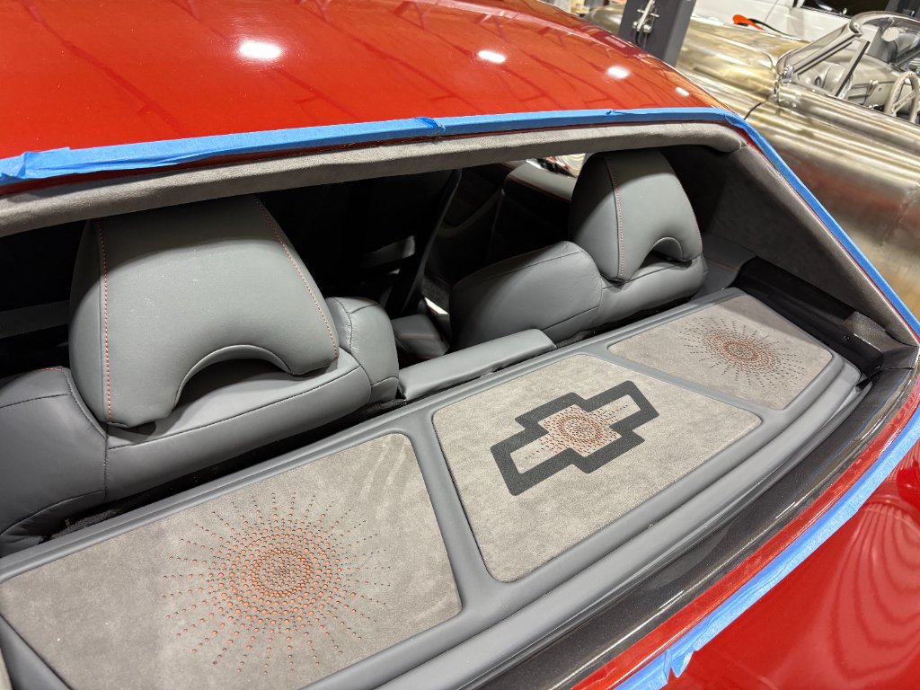 Rear deck — Swift Stitch custom upholstery with Bowtie emblem and starburst detail