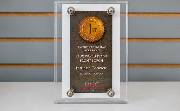 Decorative Concrete Council 1st Place award trophy for cementitious overlays under 5,000 SF, faux wood plank front porch project, awarded to Intricate Concrete, Bay Area Michigan