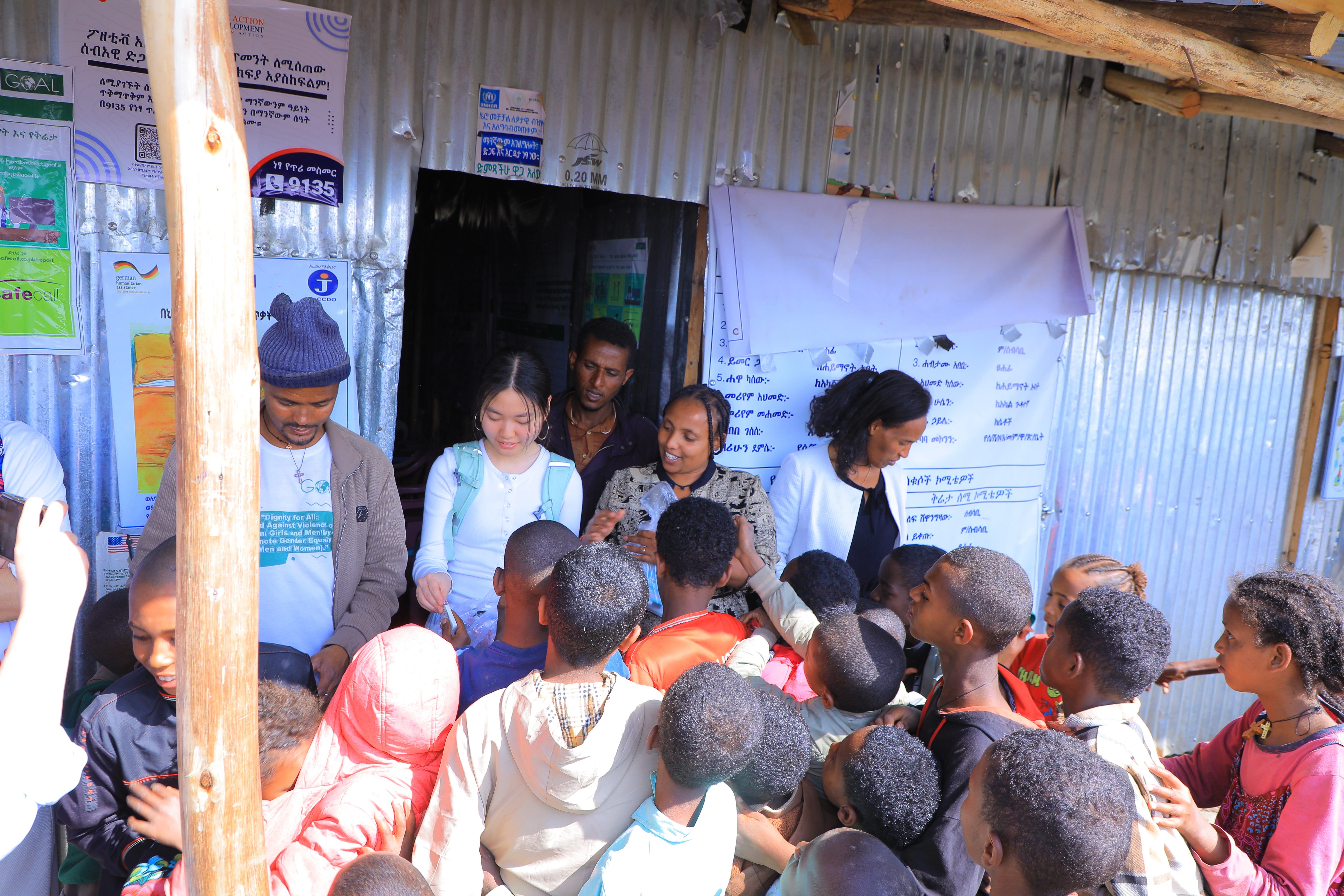 Engaging with children and families during a community distribution visit.