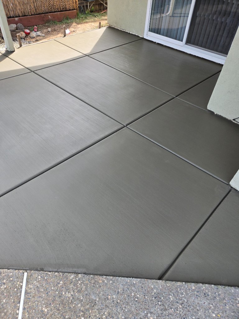 Concrete patio steps and large outdoor slab