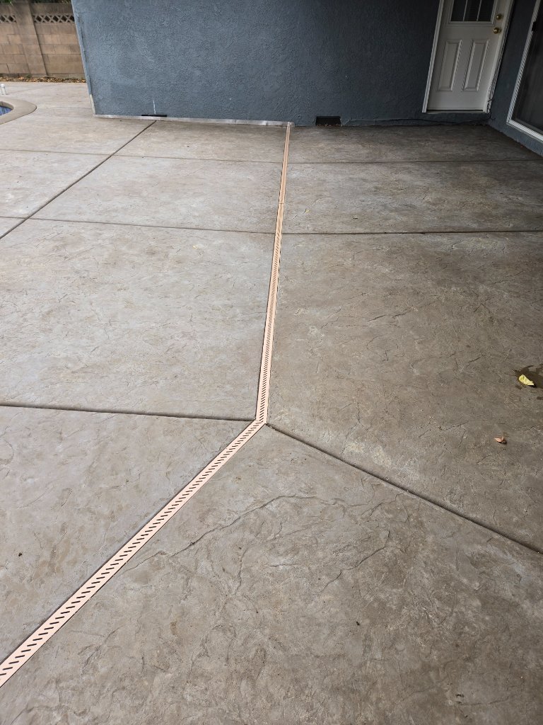 Curved concrete patio with garden border