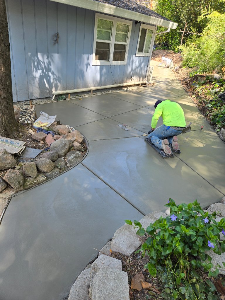 Stamped concrete patio with drain channels