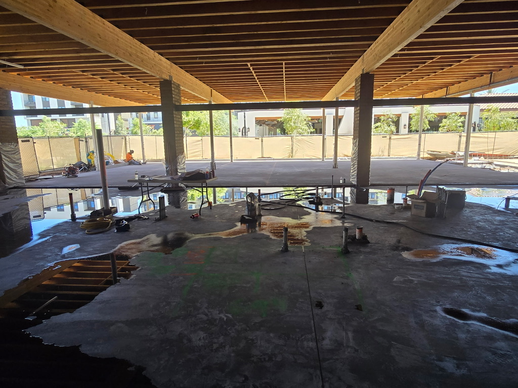 Night concrete pour crew finishing interior slab