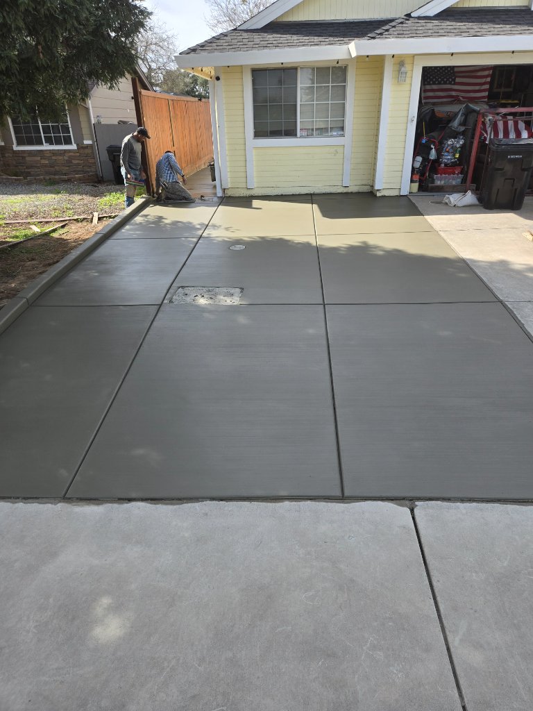 Fresh concrete driveway with clean broom finish