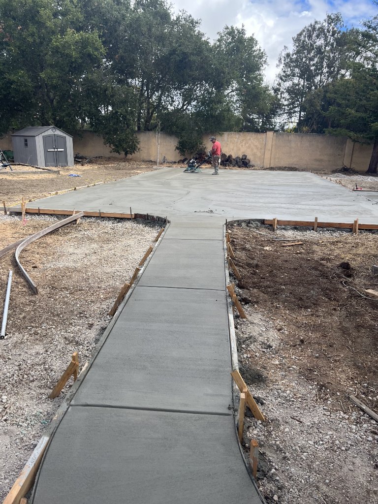 Freshly poured and broom-finished concrete driveway