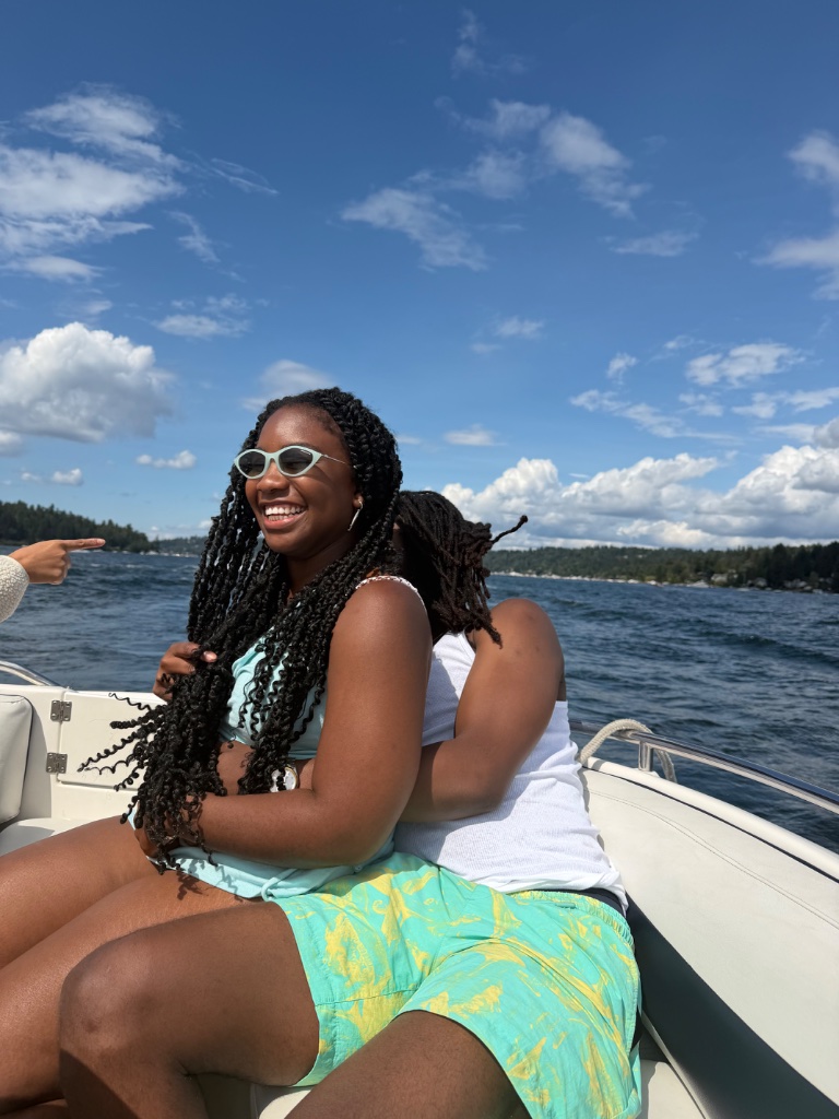 Friends embracing on the boat deck