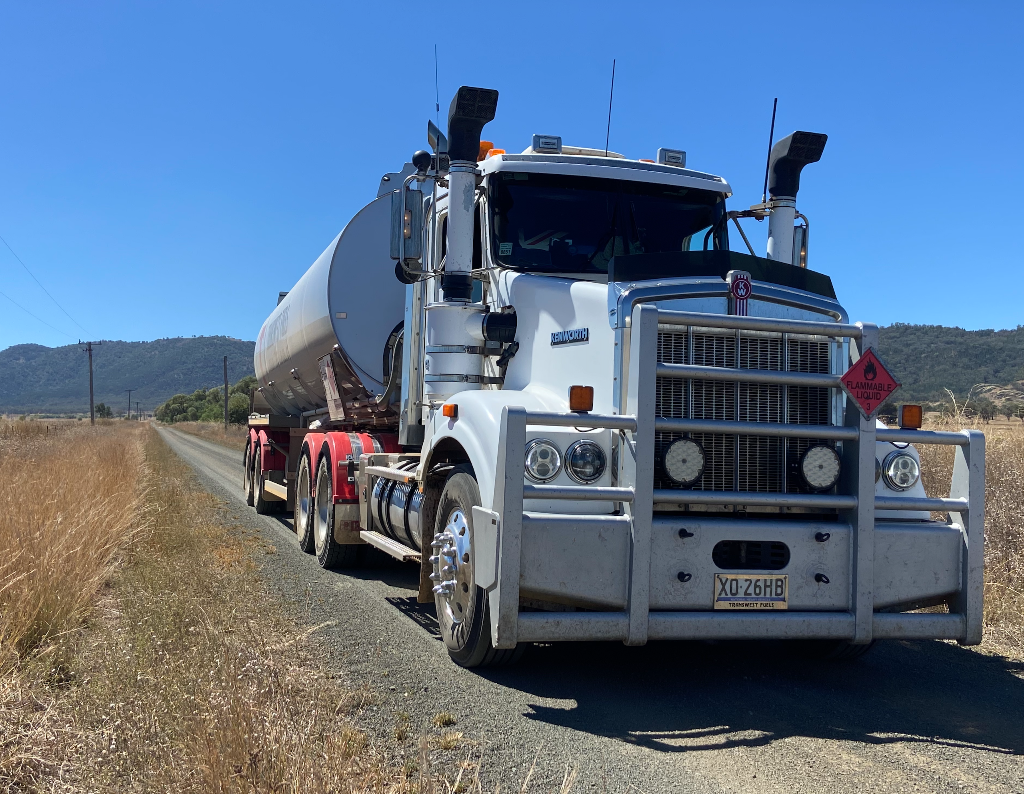 Commercial bulk fuel tanker truck on rural road