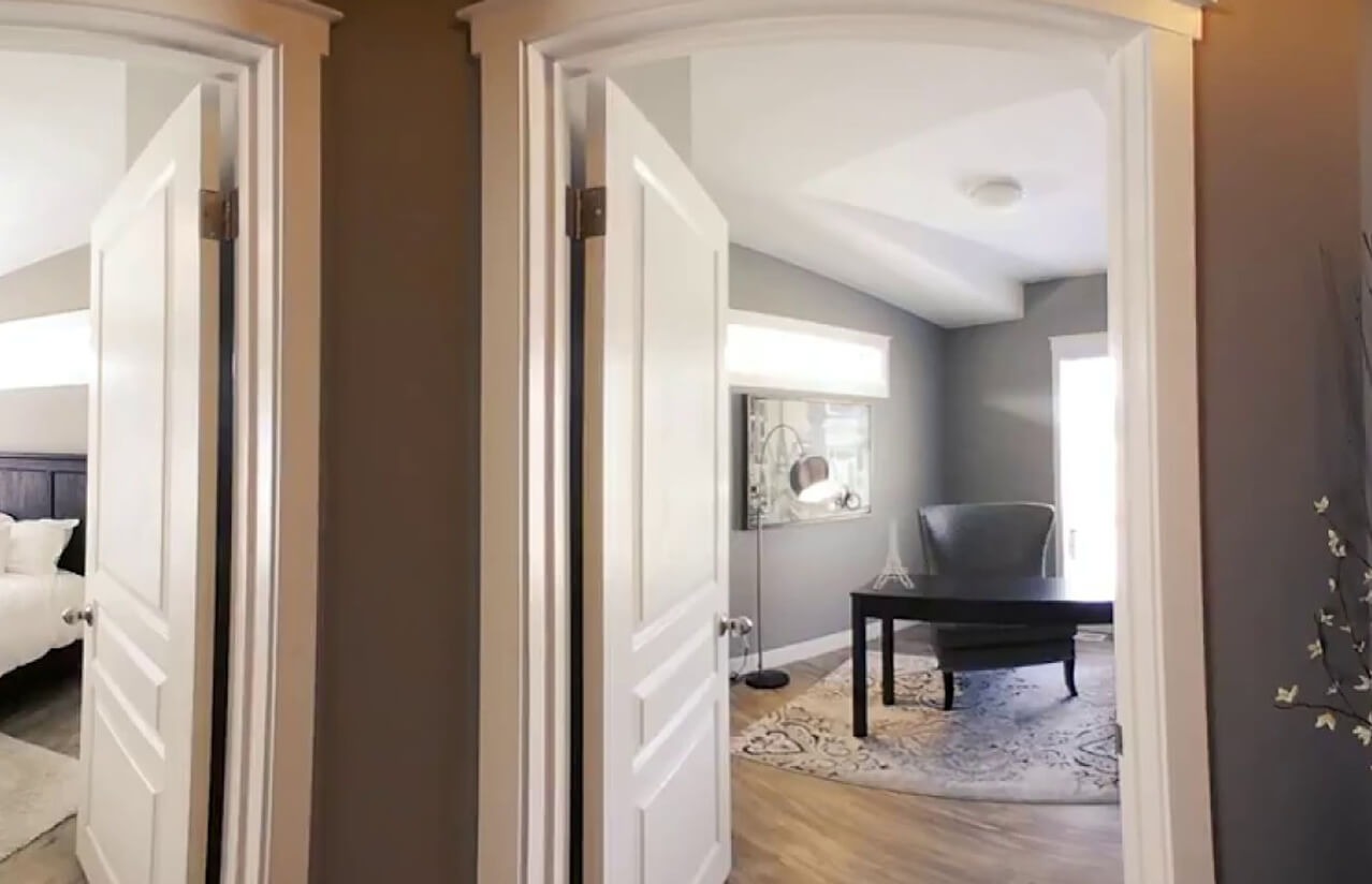 Home interior with bright doorways and a comfortable sitting room