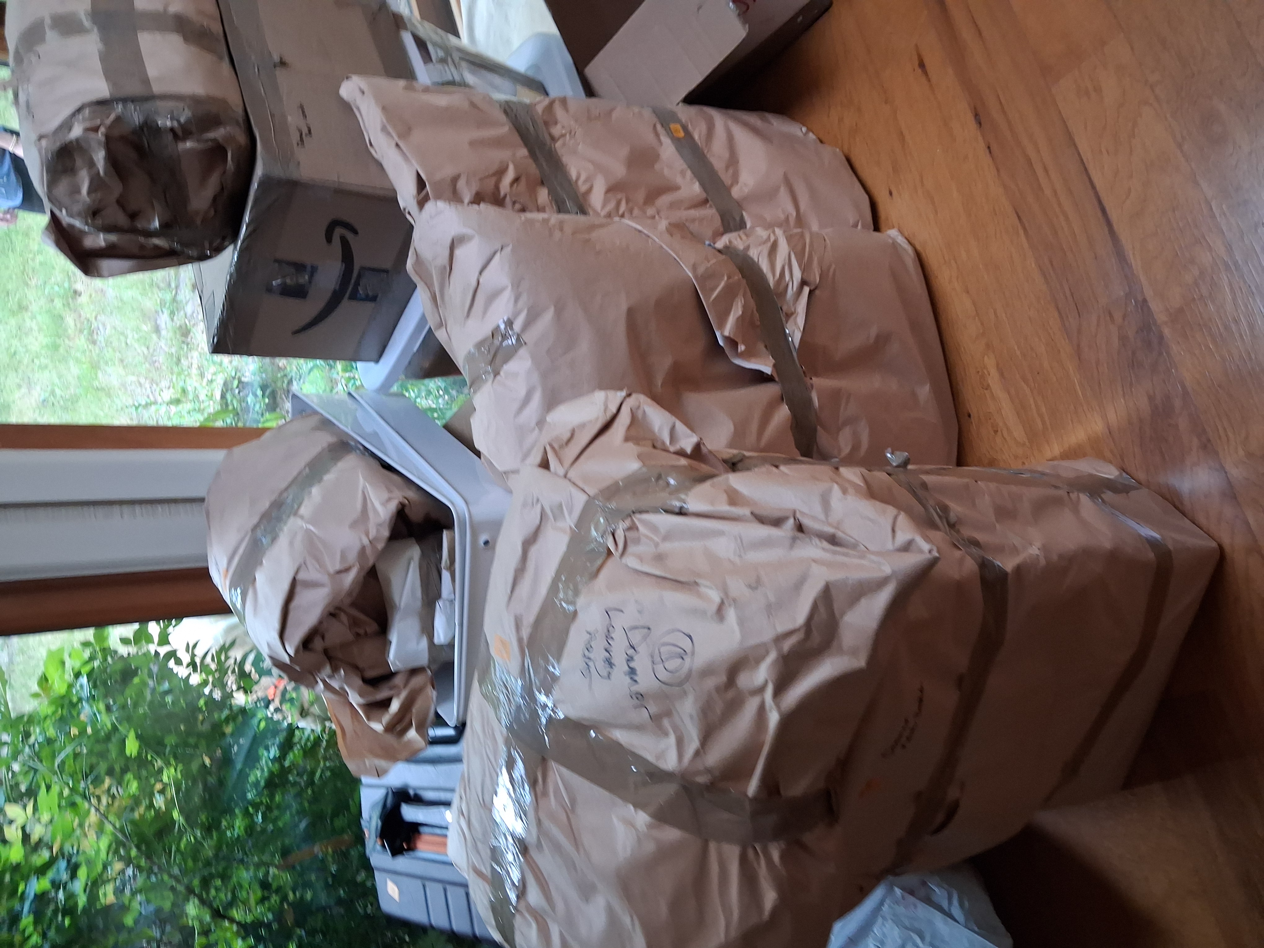 Furniture wrapped in protective packing paper and tape