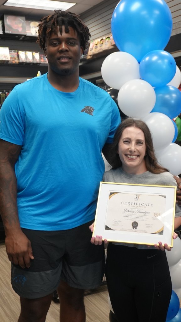 Cam Jackson presenting the Certificate of Recognition