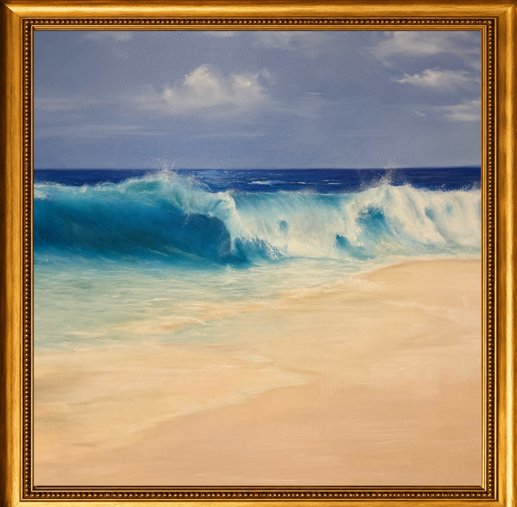 A turquoise wave crests and breaks over white sand beneath a soft blue sky — light, movement, and the eternal rhythm of the sea.