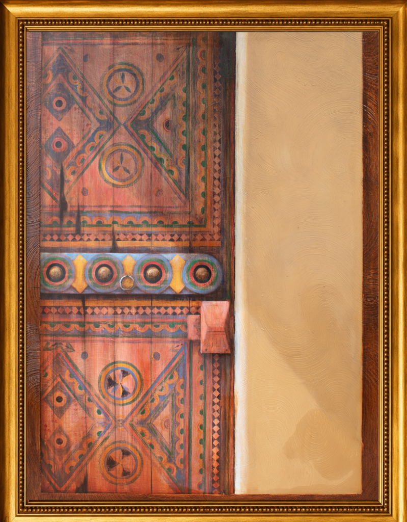 A richly detailed study of an ornately painted traditional Saudi door, its geometric and floral motifs speaking to centuries of living craft tradition.