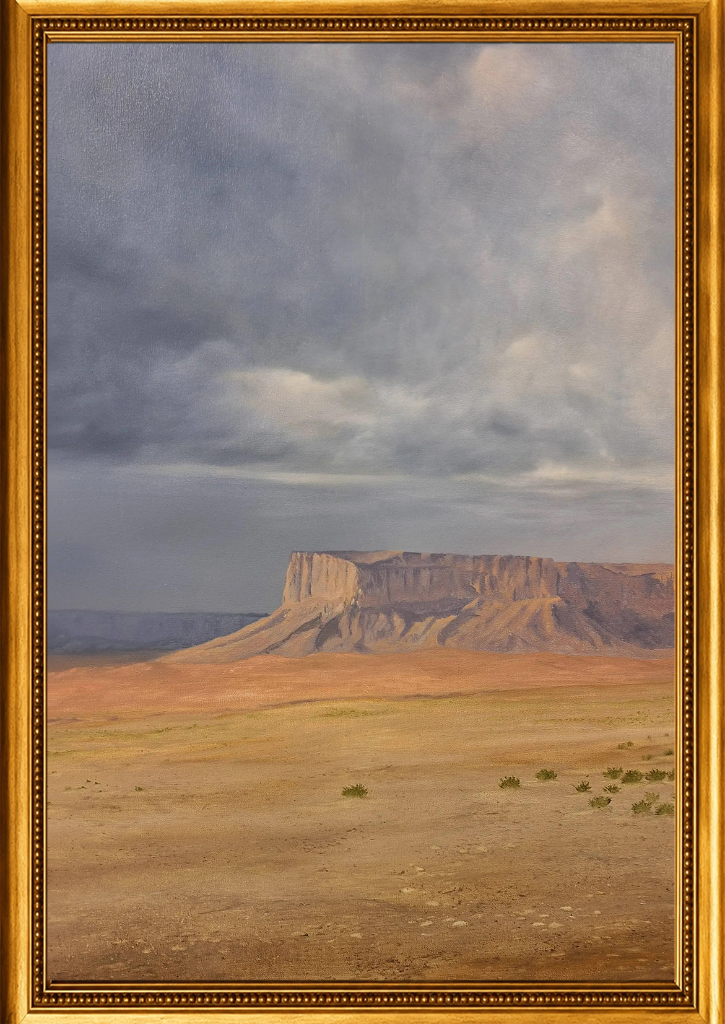 A vast desert plateau emerges beneath brooding storm clouds — the silence of the Arabian interior captured in warm ochres and cool greys.