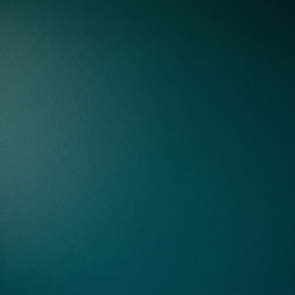 Deep teal matte painted surface close up