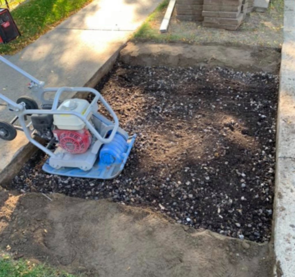 Plate compactor base preparation for paving stone installation