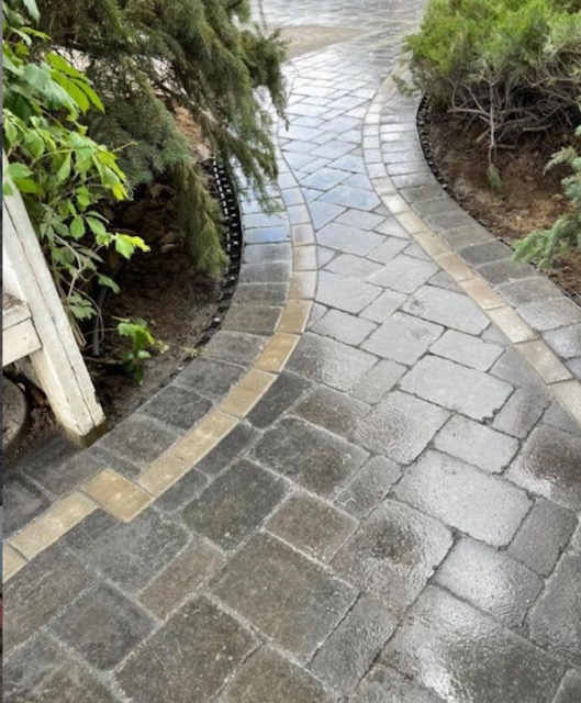 Paving stone repair area with existing cobblestone pattern