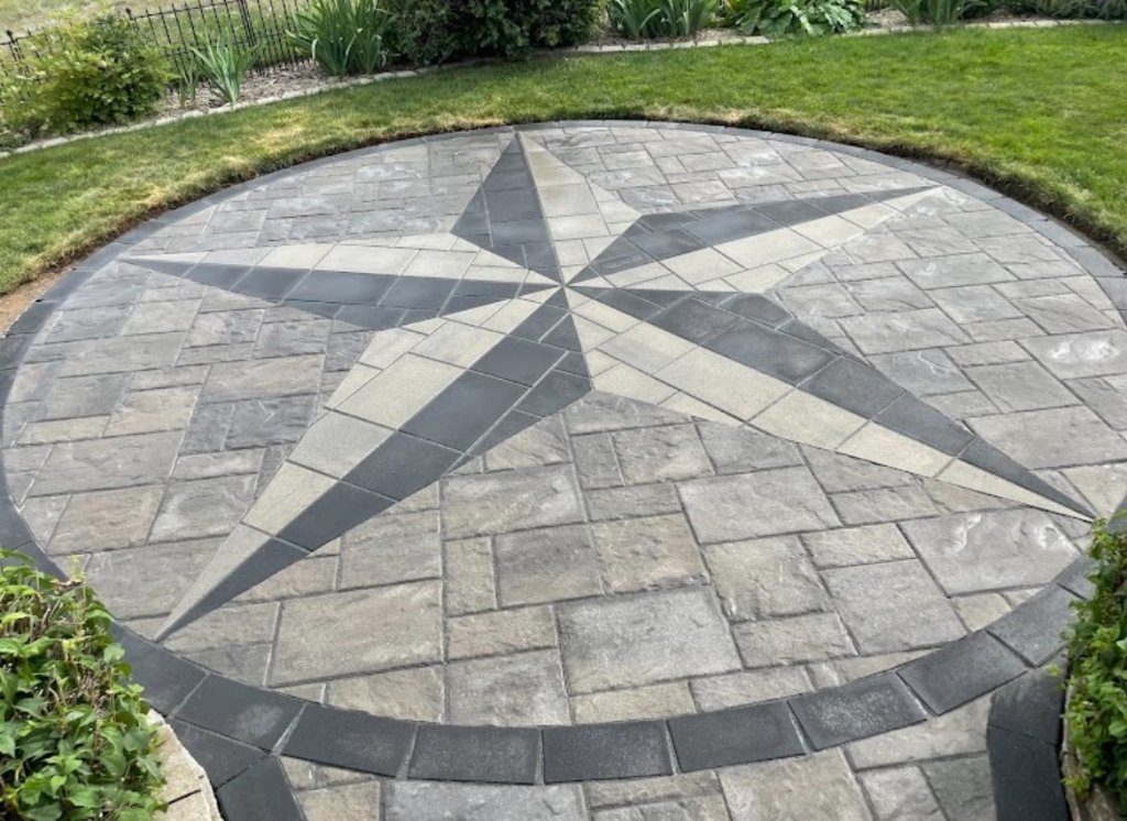 Custom paving stone patio with star medallion design by Artistic Elements Medicine Hat