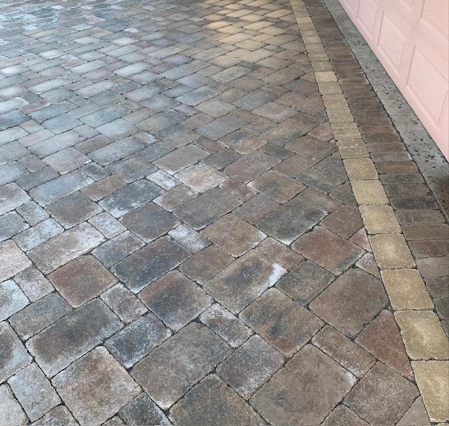 Close-up of interlocking paving stone driveway with border detail