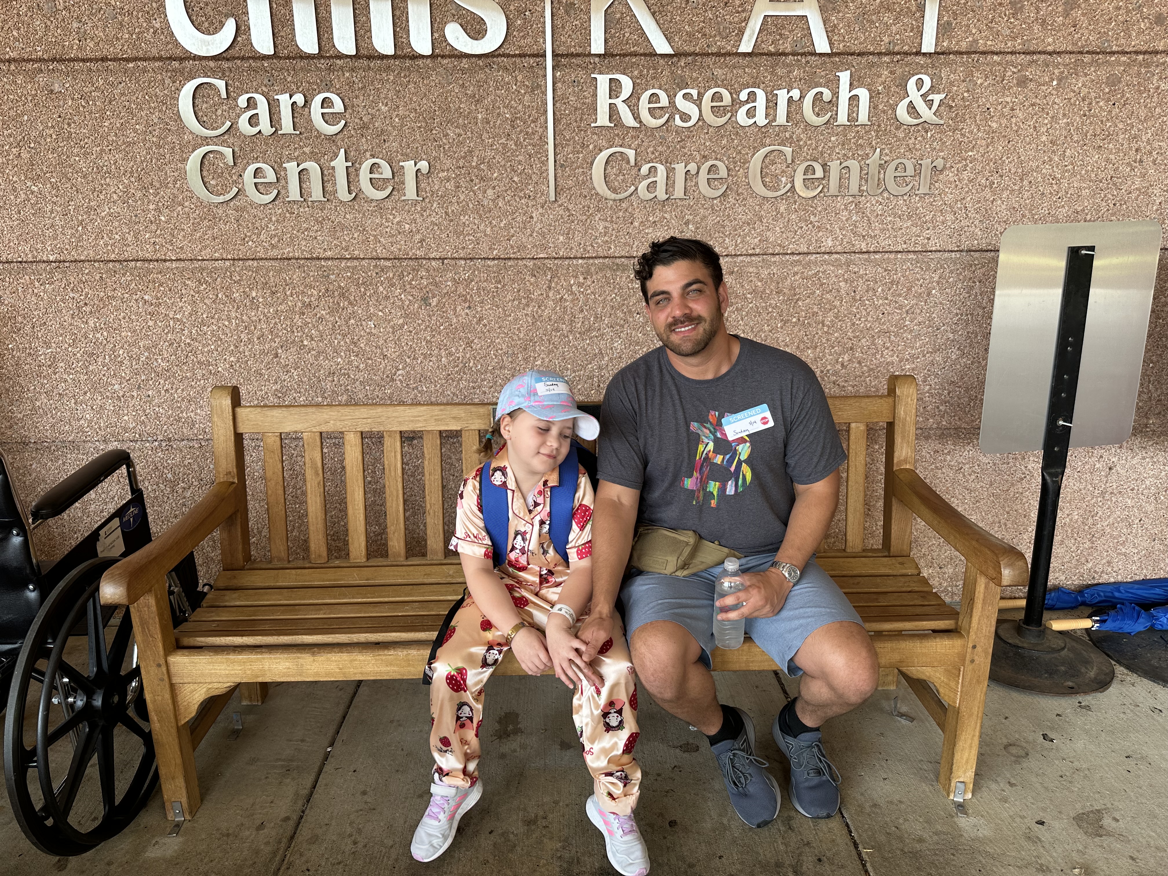 Lakyn outside the children's care center with her dad