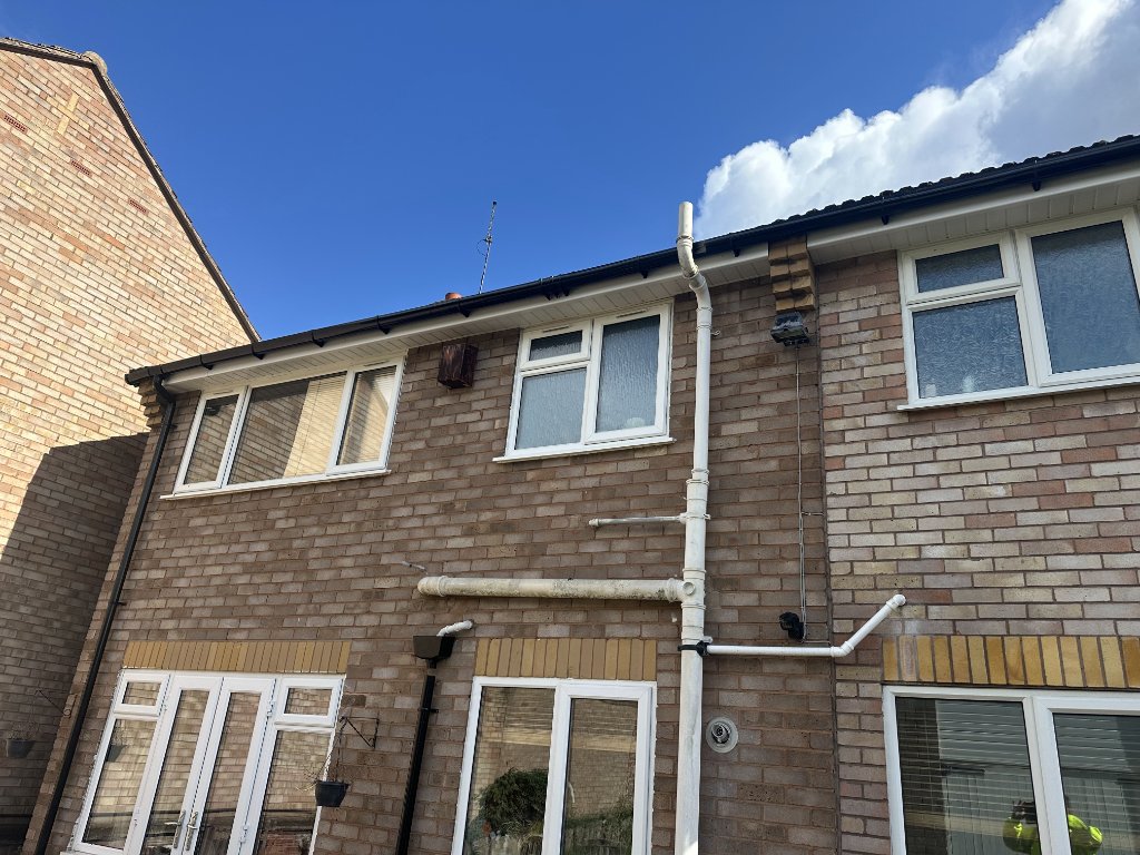 Fascias & soffits Worcester — white UPVC fascia boards and soffits on brick house