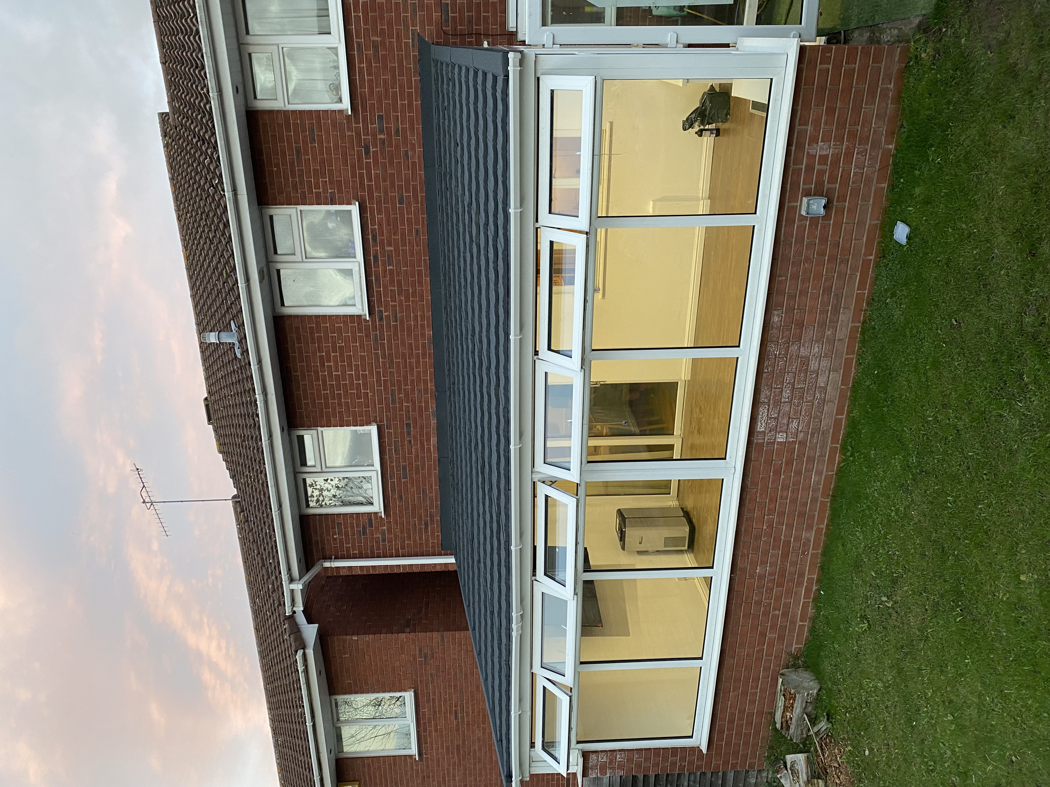 Conservatory with charcoal tiled warm roof, high-angle view