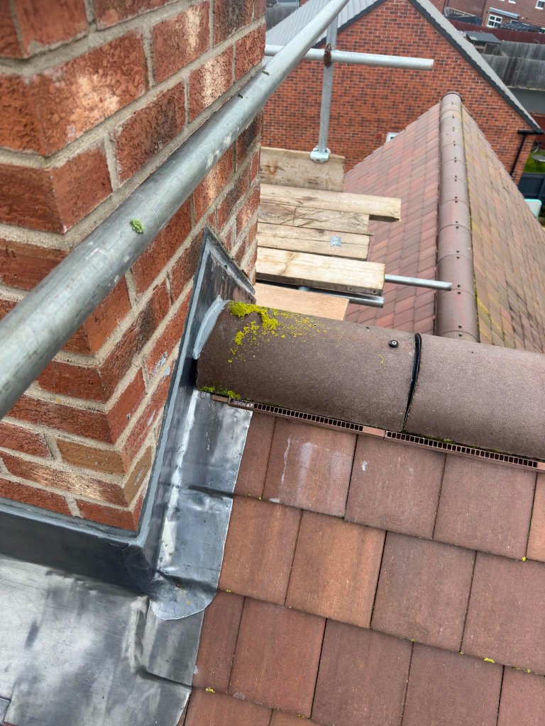Leadwork Worcester — lead flashing at chimney base meeting tiled roof