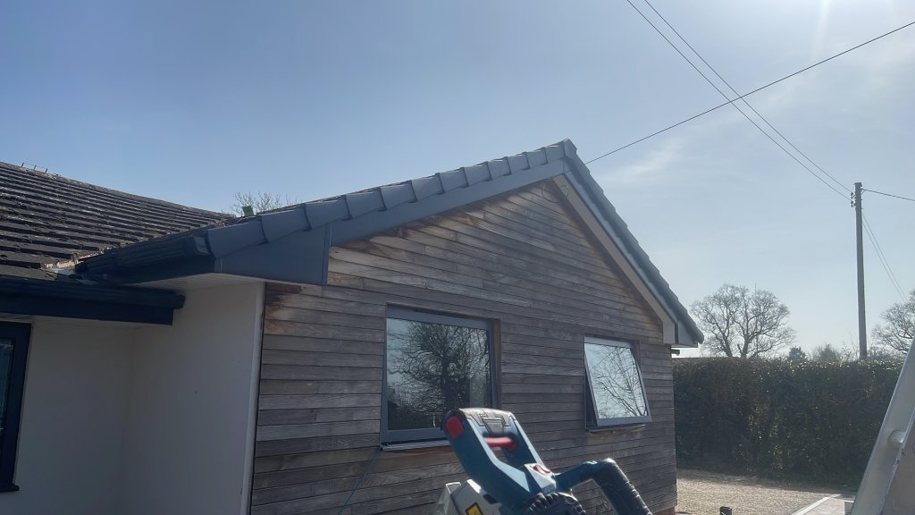 Fascias & soffits Worcester — charcoal fascia and soffit installation in progress