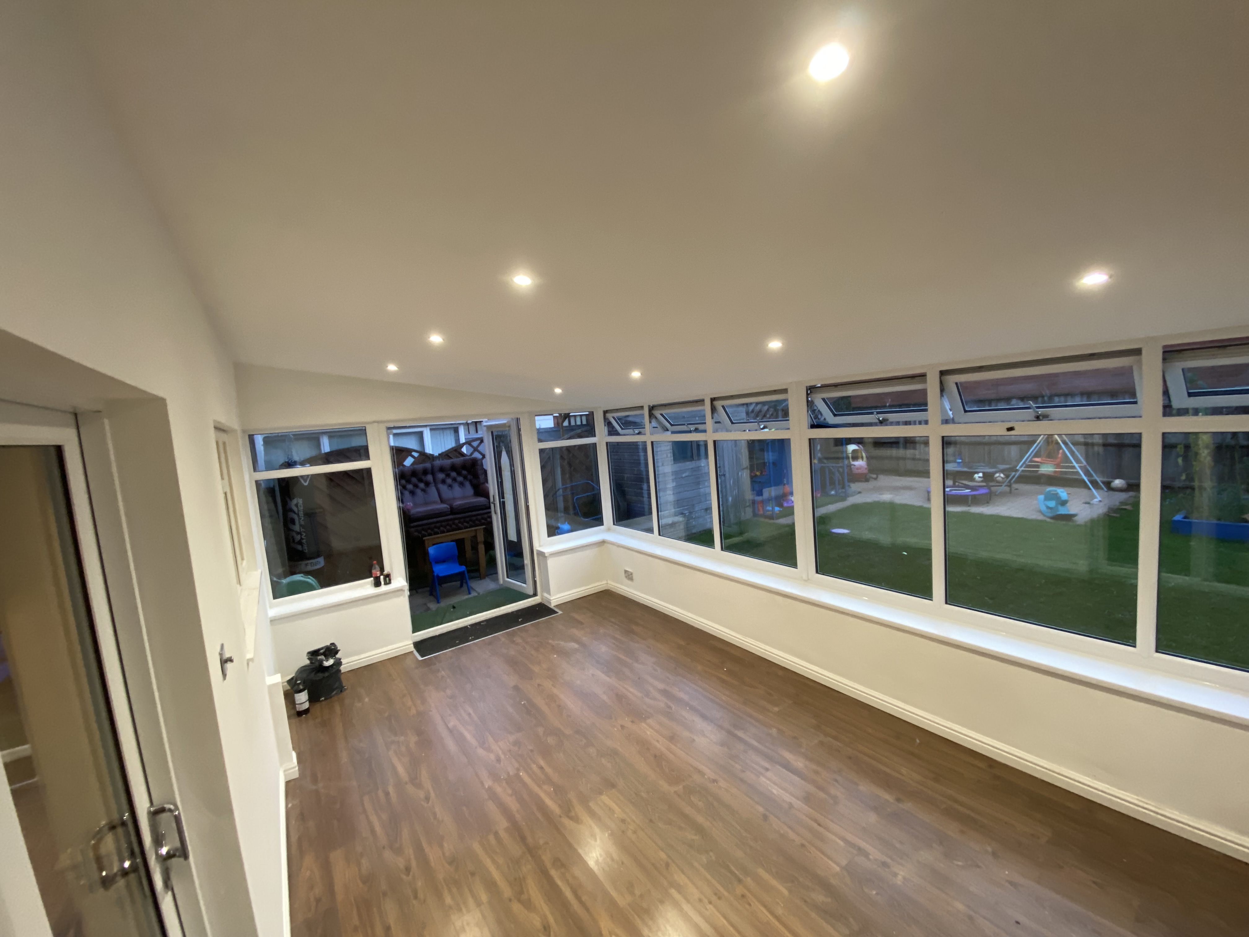 L-shaped conservatory converted into a bright living space