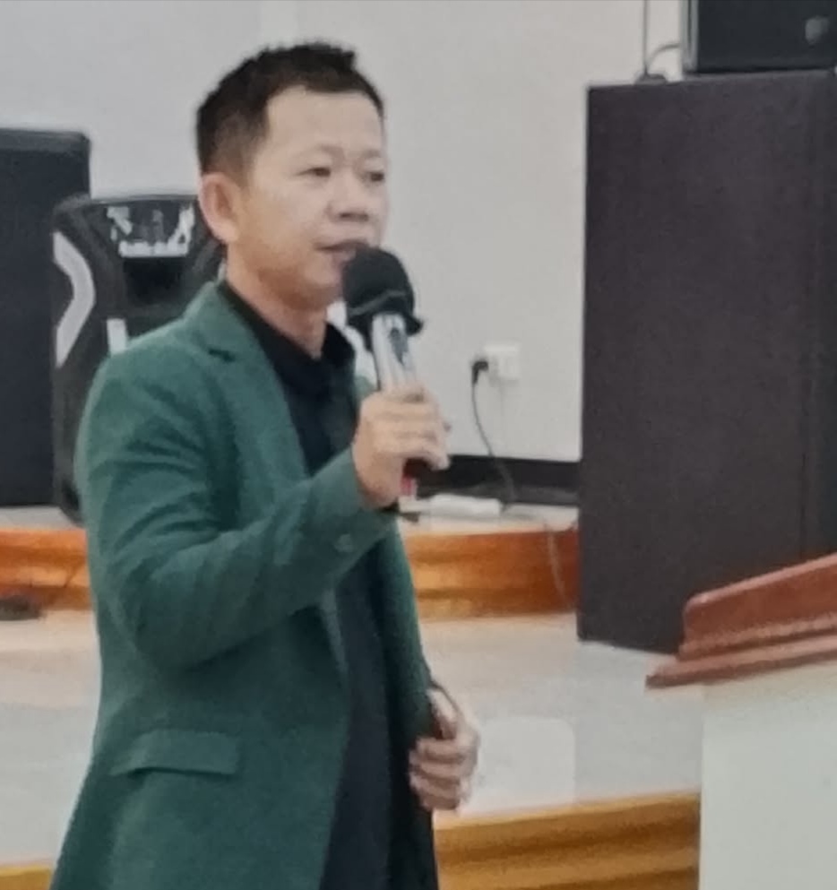Brother Aslerado speaking at the podium during the School of Intimacy for Leaders
