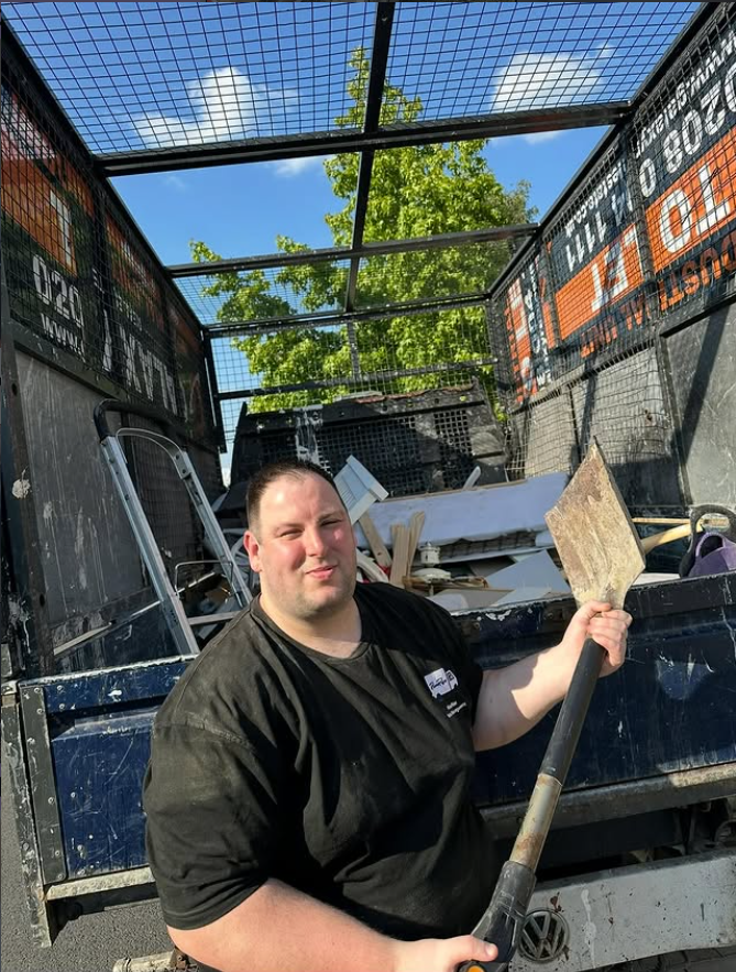 RicaRise waste clearance professional at collection truck in Wimbledon