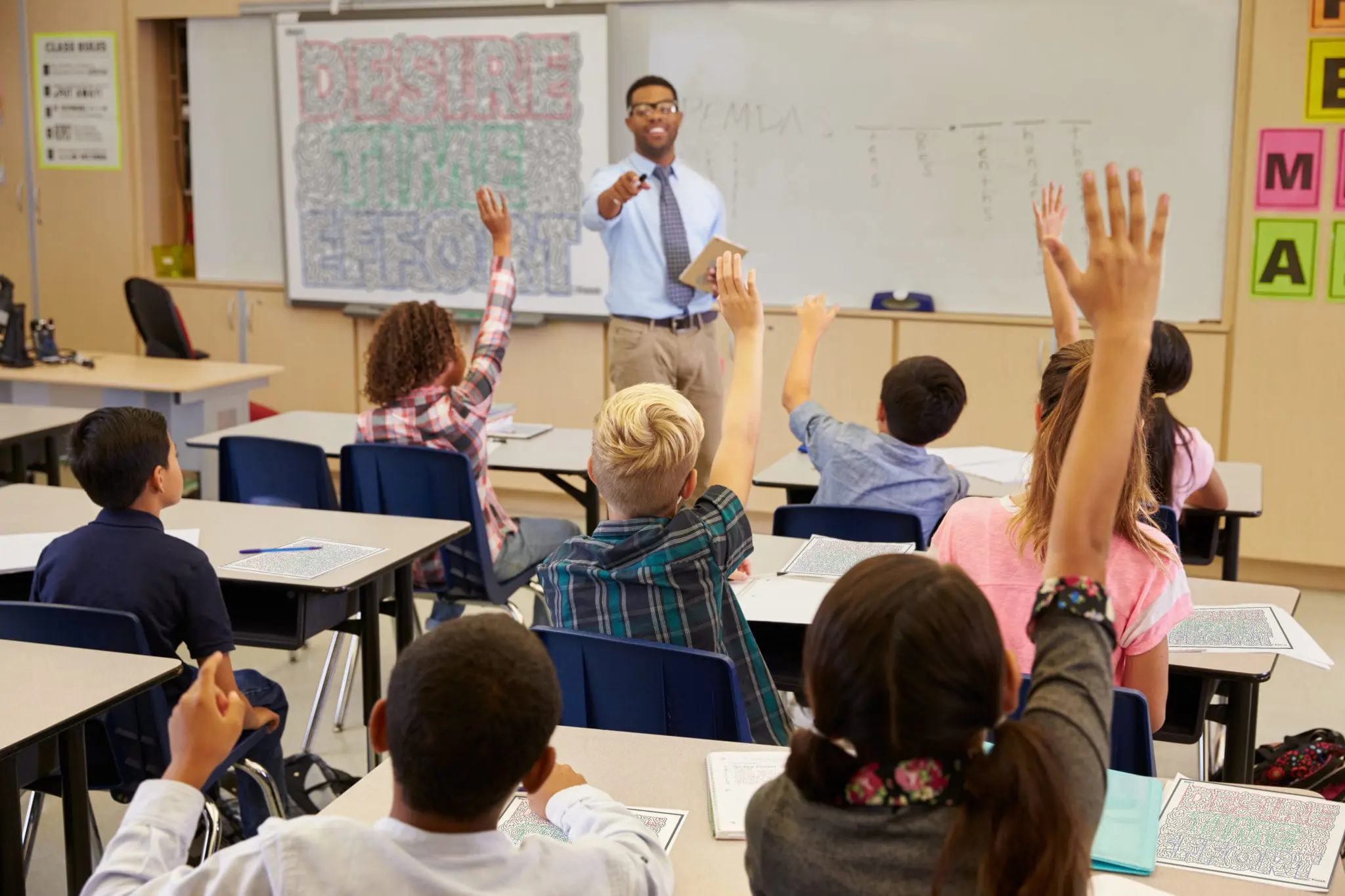 Teacher helping student