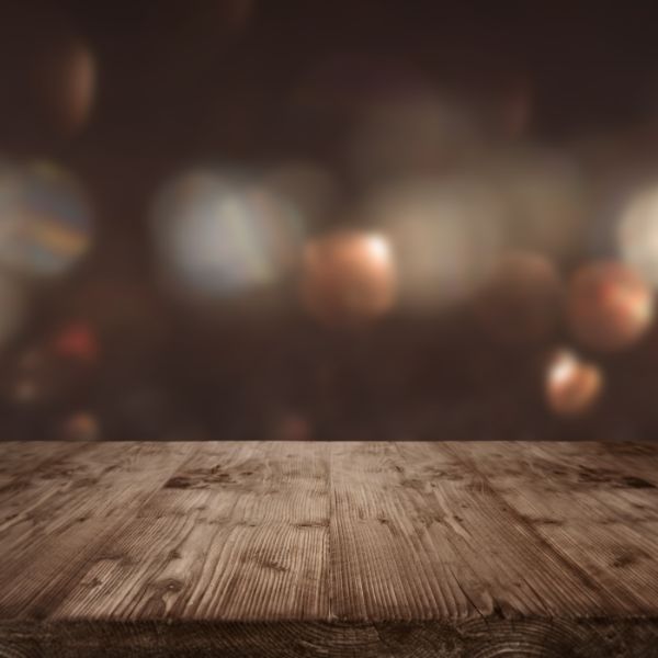 A warm wooden table set for gathering