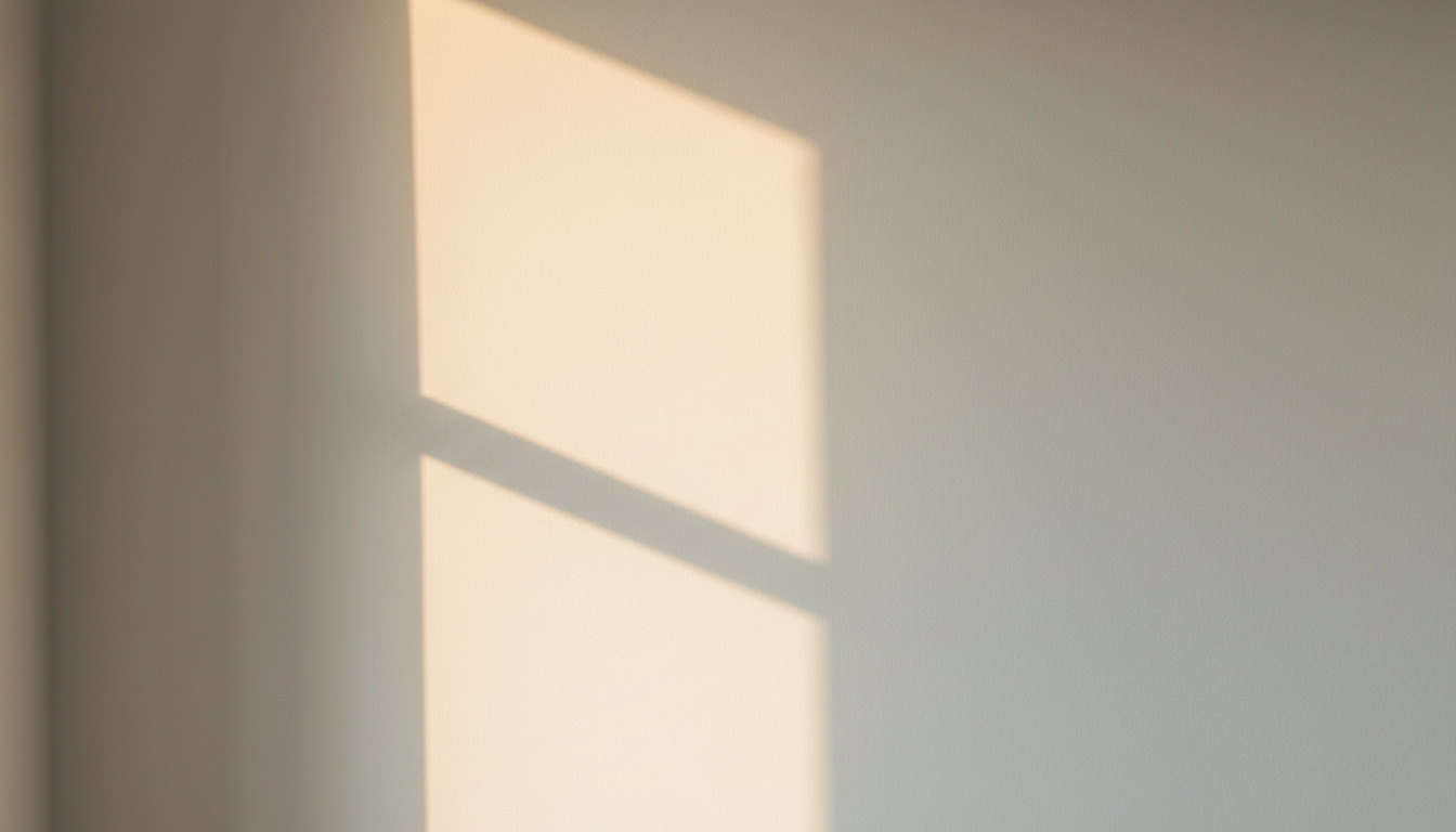 Warm light casting gentle shadows on a therapy space wall