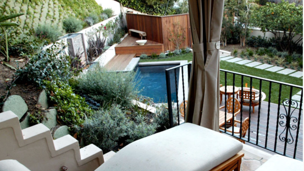 Hillside multi-level garden — plunge pool, cedar deck, fire table terrace, Mediterranean planting